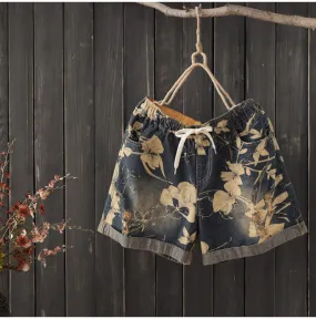 AUTUMN ROLL HEM DENIM SHORTS IN FLORAL PRINT   