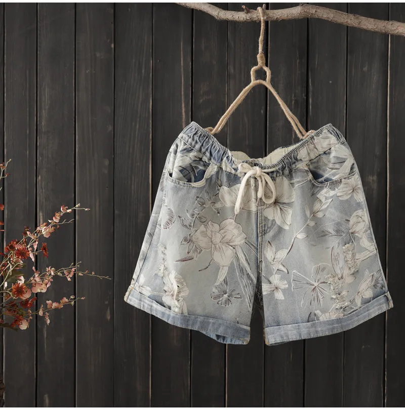 AUTUMN ROLL HEM DENIM SHORTS IN FLORAL PRINT   