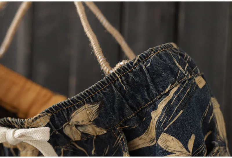AUTUMN ROLL HEM DENIM SHORTS IN FLORAL PRINT   