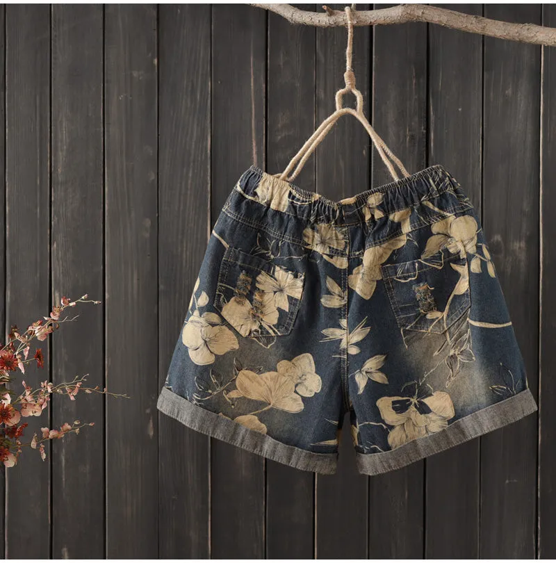 AUTUMN ROLL HEM DENIM SHORTS IN FLORAL PRINT   